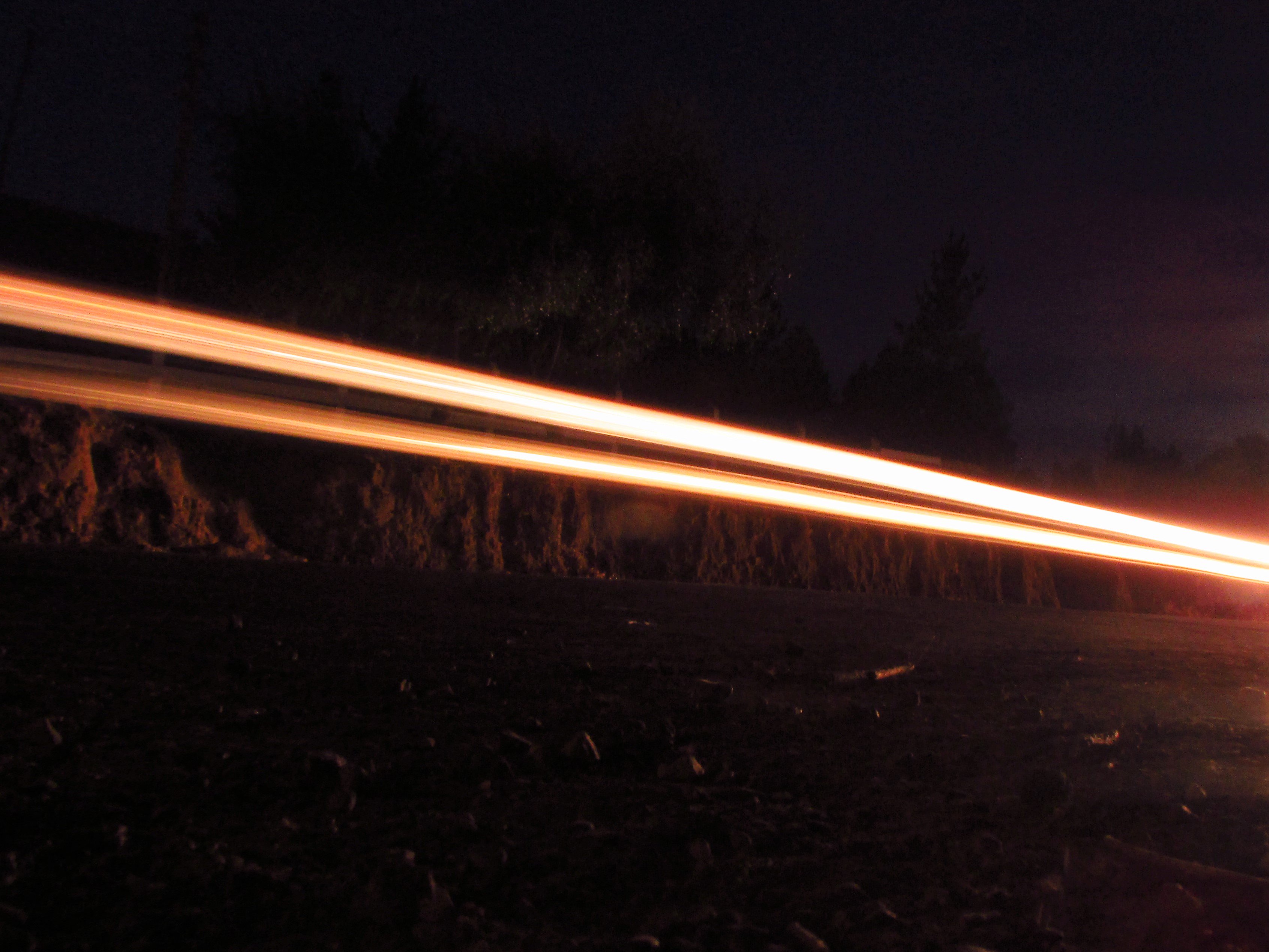 Long exposure shot of a road capturing the glow of car headlight, Longaví, Chile